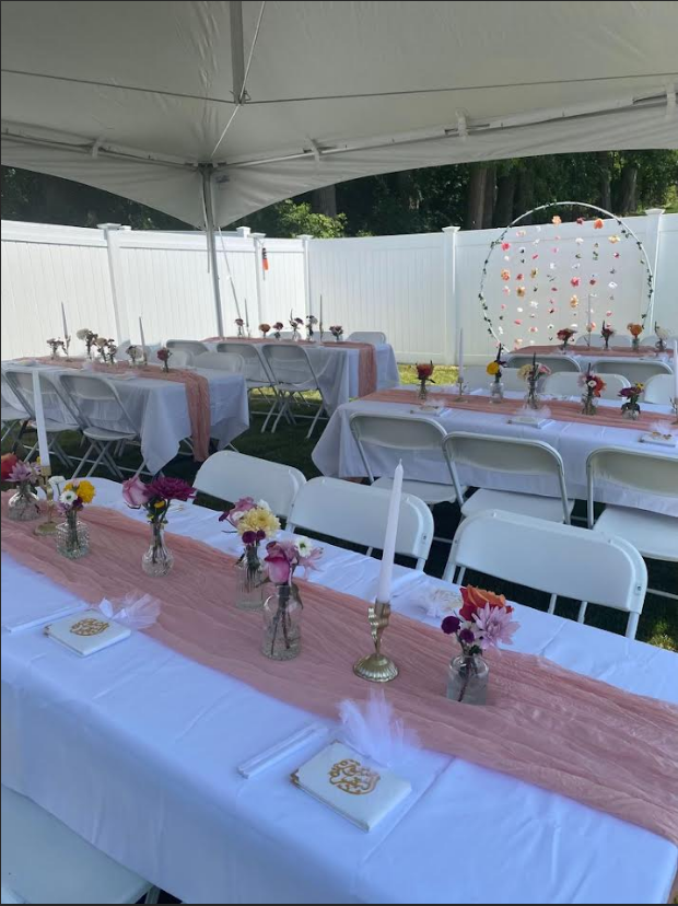 Bounce-N-Bash team setting up a party tent